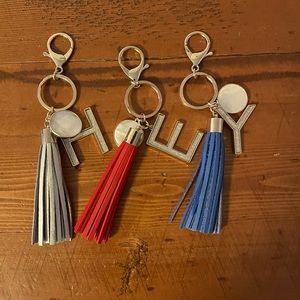 H. E. Y. Initials Keychains with leather tassels.